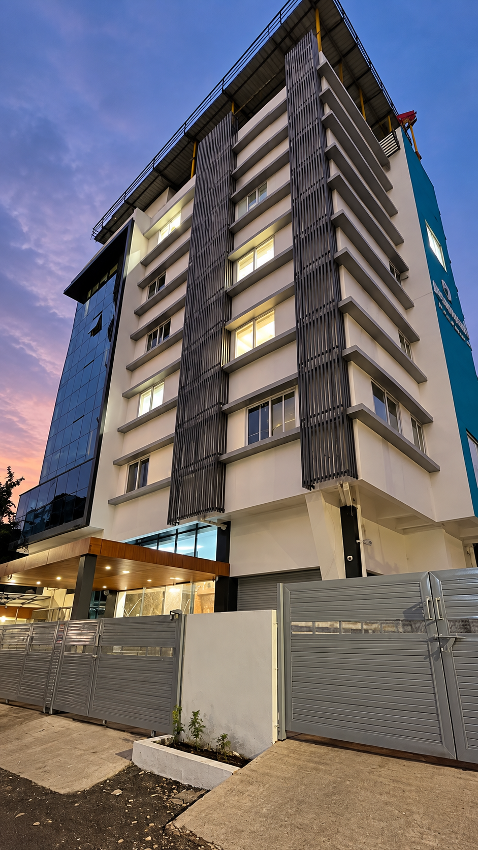 Hospital building at twilight with illuminated windows